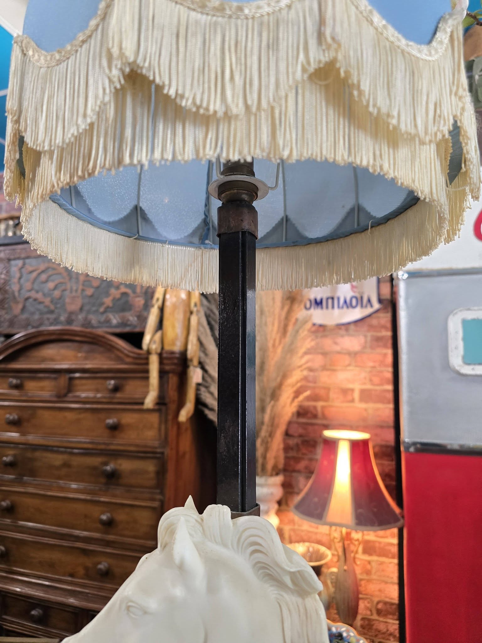 Vintage table lamp blue fabric shade and a white sculpted horse head bust on a black metal base