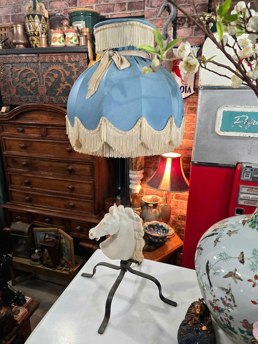 Vintage table lamp blue fabric shade and a white sculpted horse head bust on a black metal base