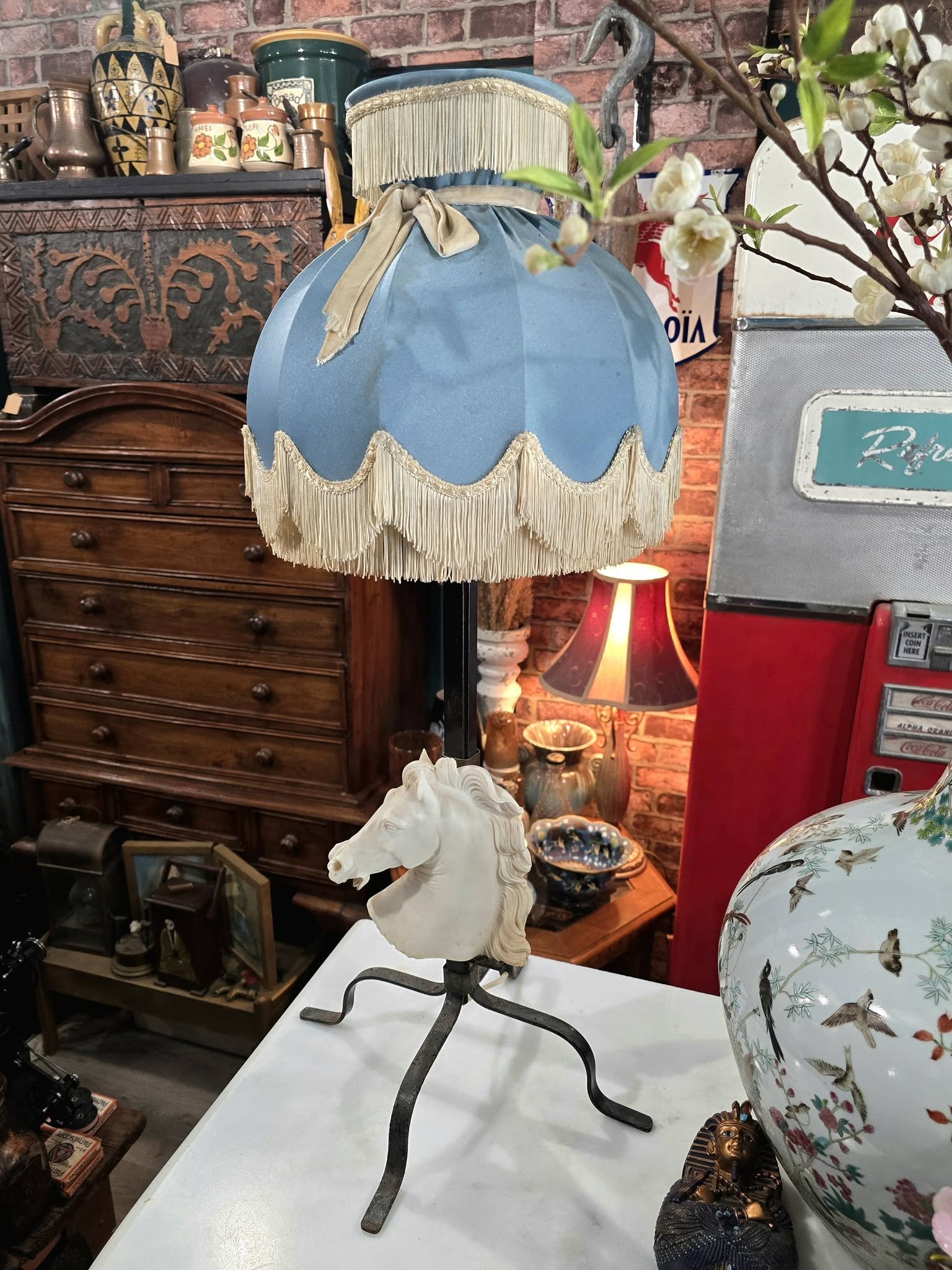 Vintage table lamp blue fabric shade and a white sculpted horse head bust on a black metal base
