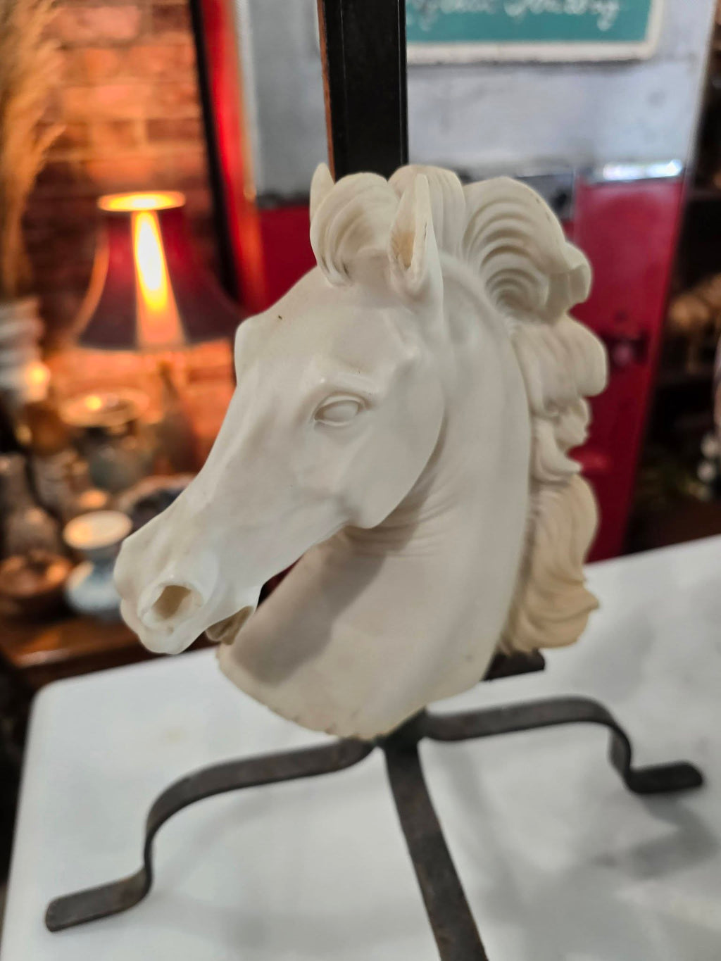 Vintage table lamp blue fabric shade and a white sculpted horse head bust on a black metal base