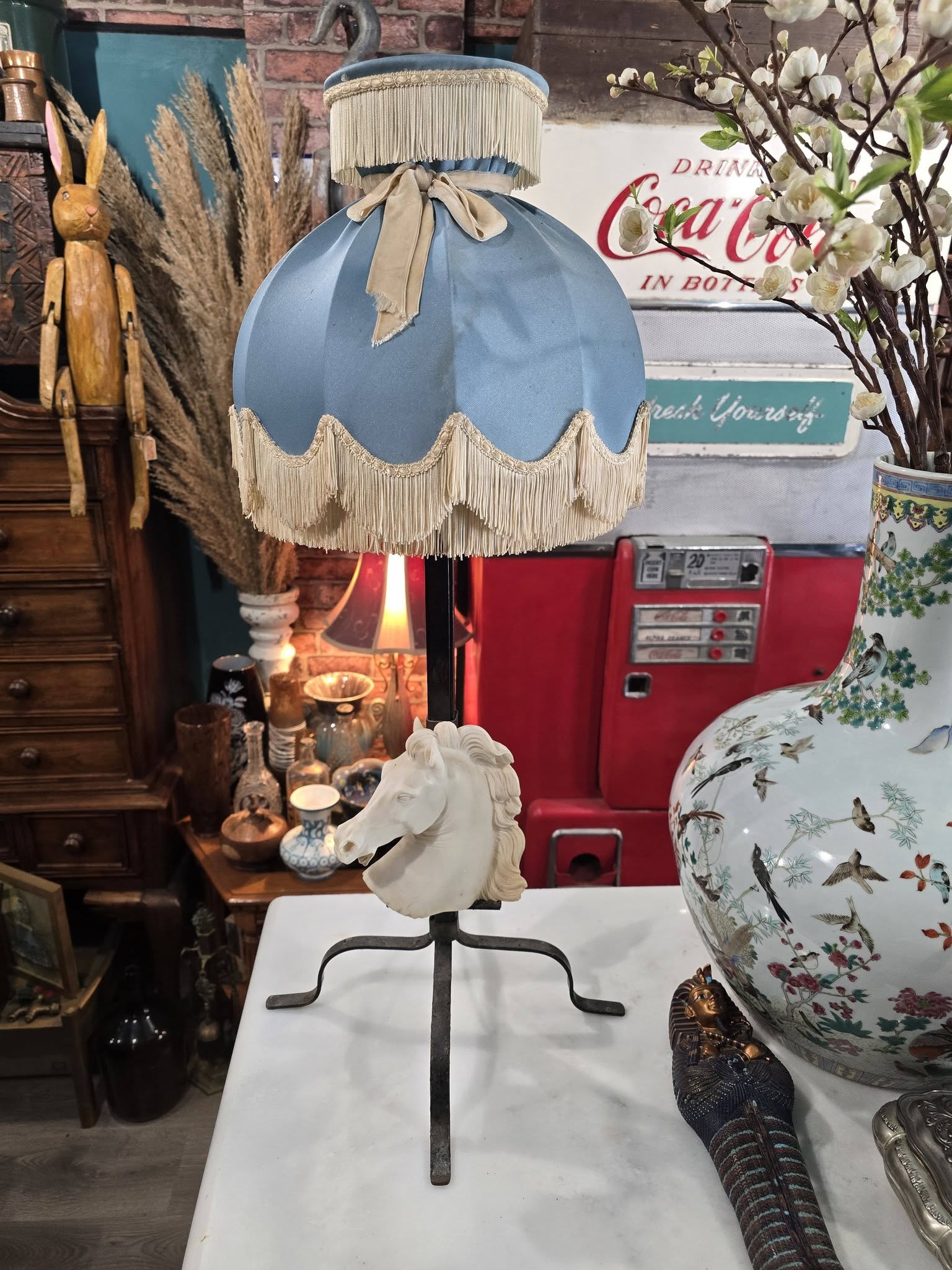 Vintage table lamp blue fabric shade and a white sculpted horse head bust on a black metal base