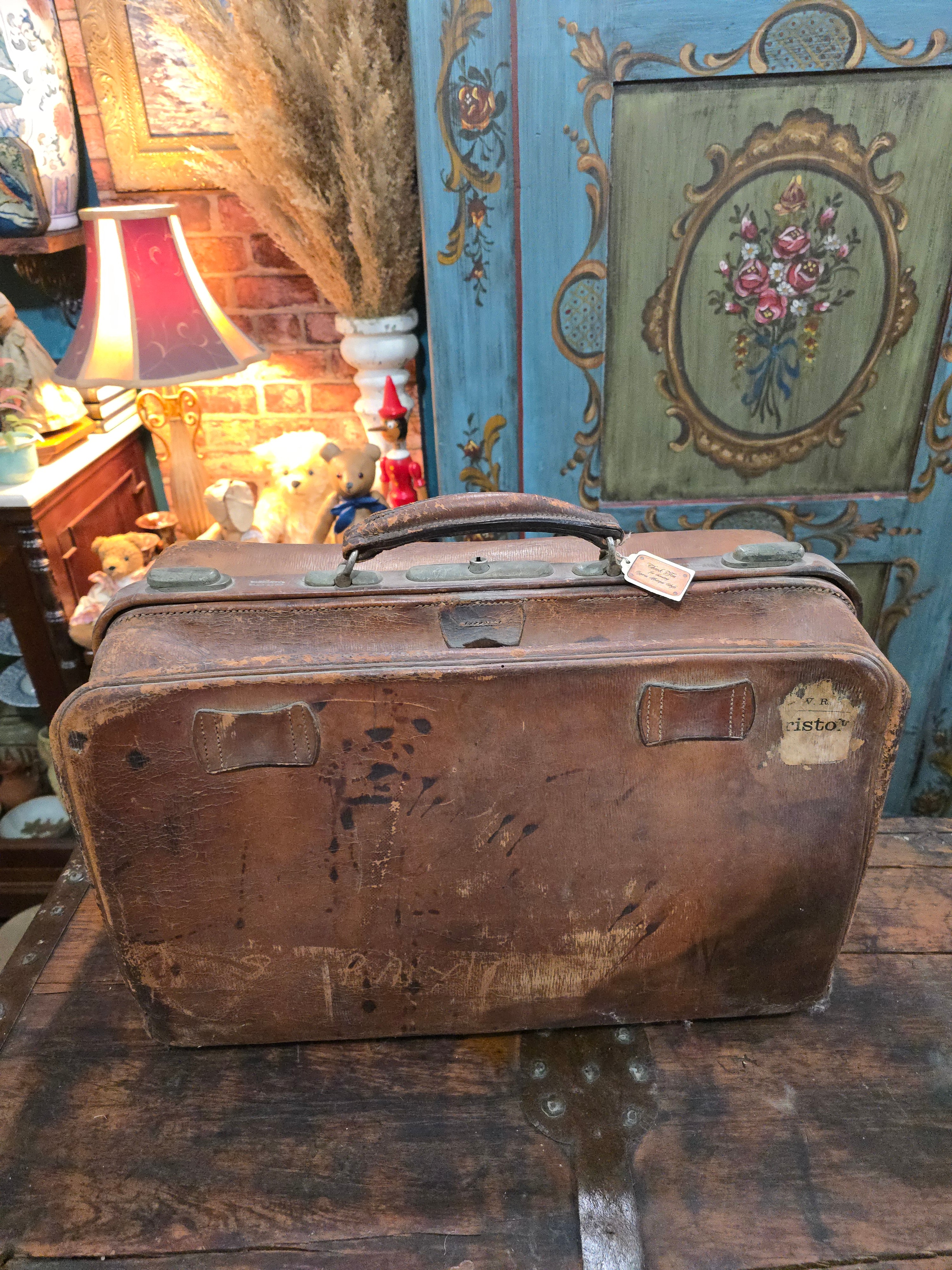 Antique brown leather suitcase bag