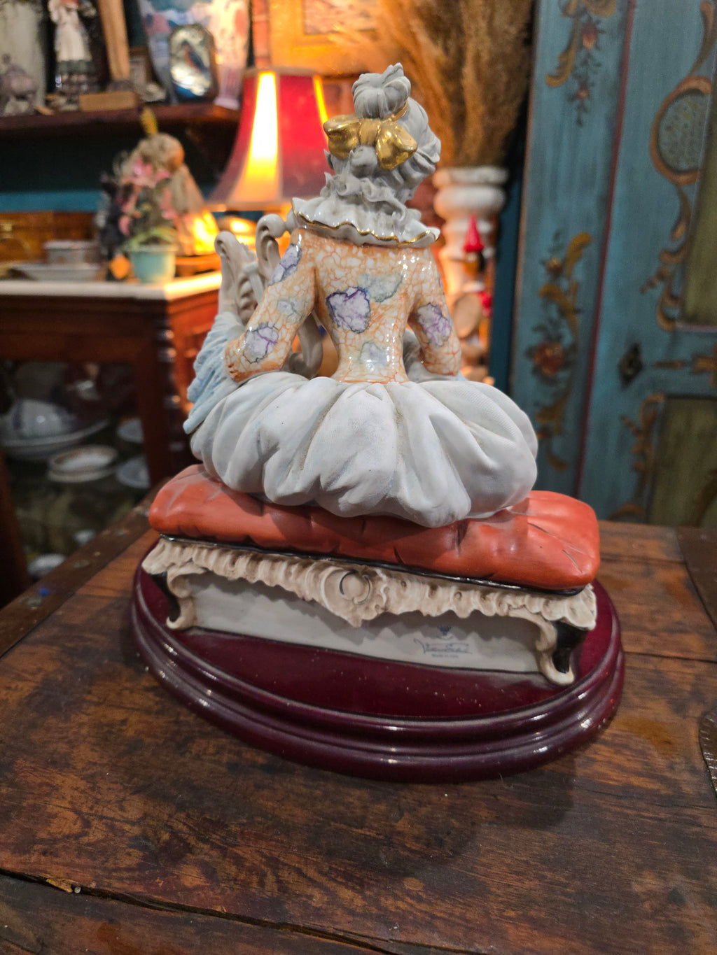 Vittorio Sabadin Italian porcelain figurine titled "Dame à la lyre"featuring a woman in a Rococo-style dress.