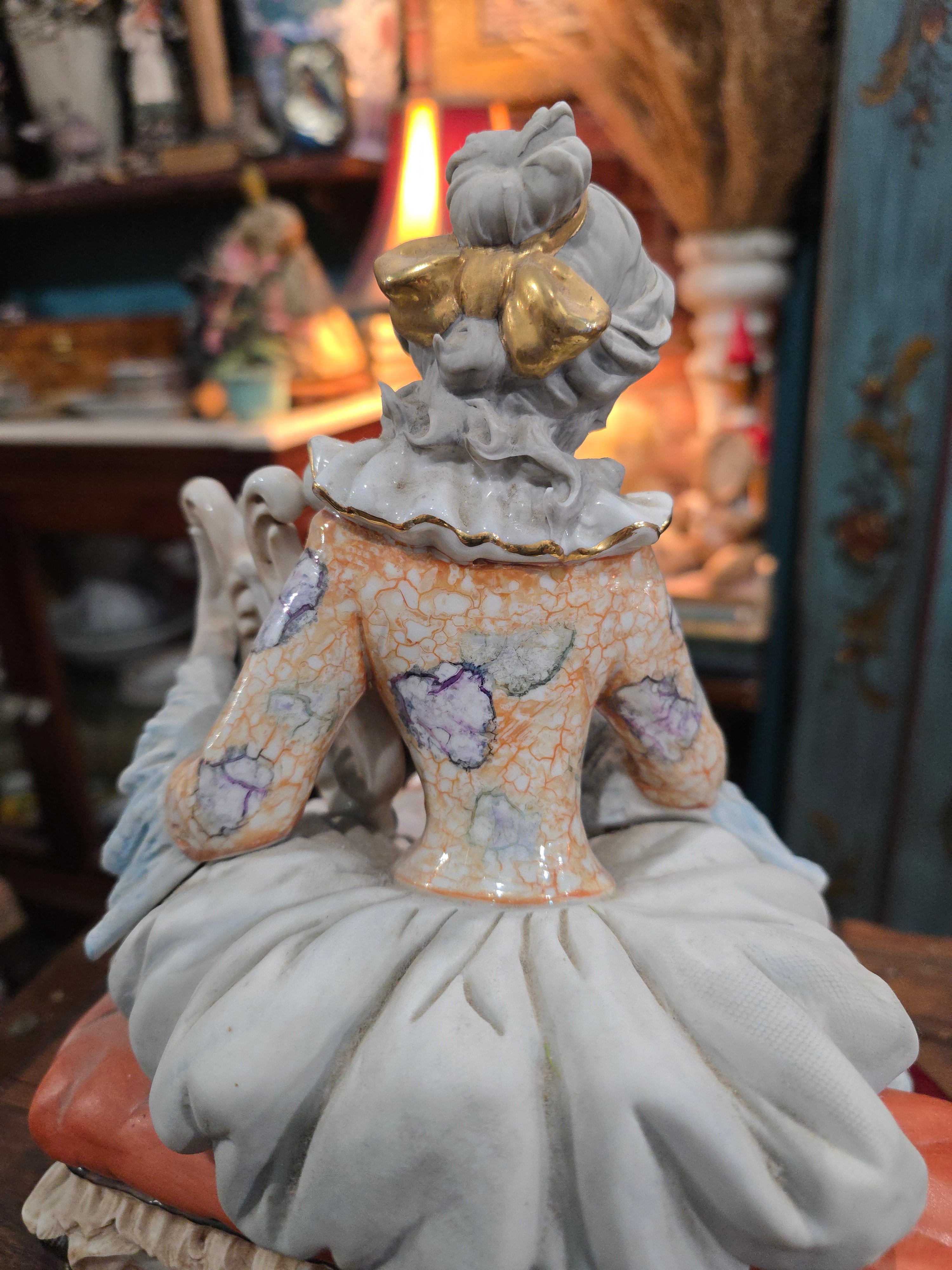 Vittorio Sabadin Italian porcelain figurine titled "Dame à la lyre"featuring a woman in a Rococo-style dress.