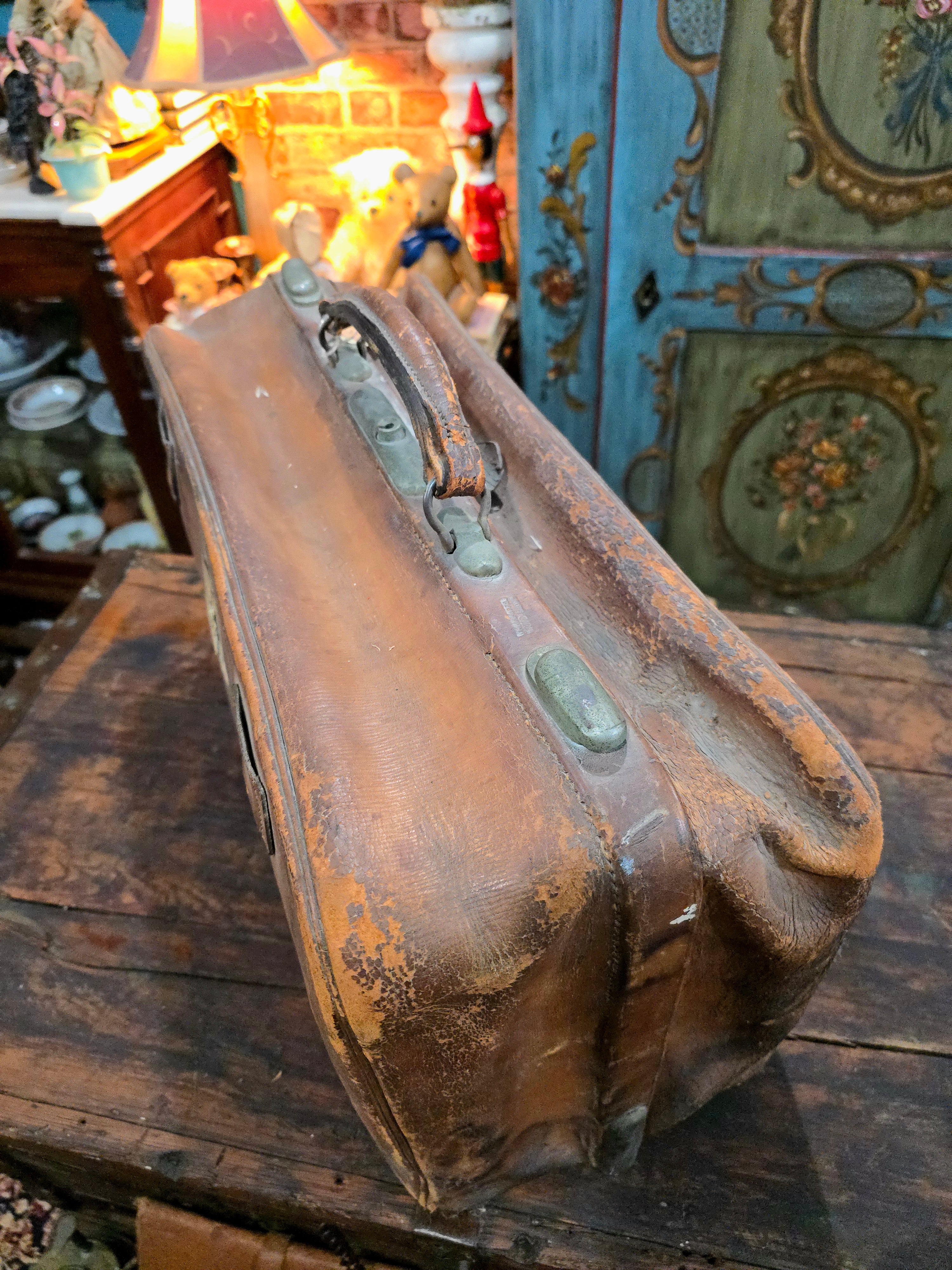 Antique brown leather suitcase bag
