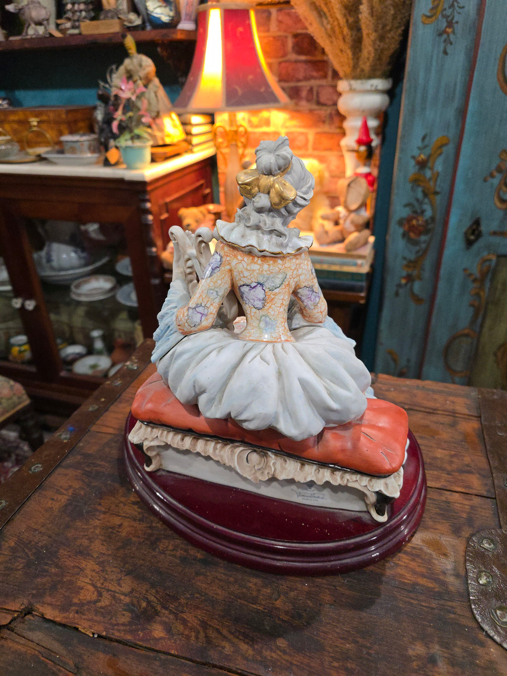 Vittorio Sabadin Italian porcelain figurine titled "Dame à la lyre"featuring a woman in a Rococo-style dress.